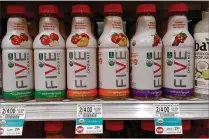  ?? JEFF OSTROWSKI/THE PALM BEACH POST ?? Publix has positioned Five Organic between Vitaminwat­er and Bai.