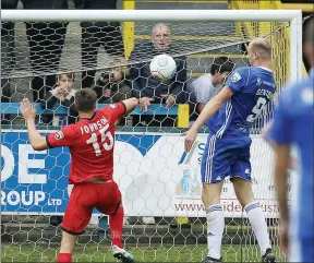  ?? PICTURE: Shutterpre­ss ?? CLINCIAL: Striker Tom Denton continues his fine goalscorin­g form by heading FC Halifax Town 2-1 in front