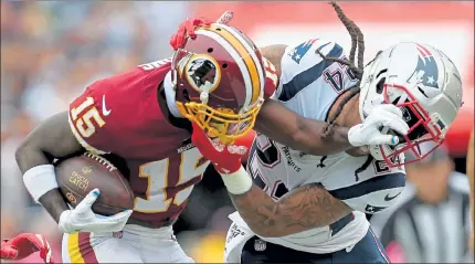  ?? NANCY LANE / BOSTON HERALD ?? Redskins wide receiver Steven Sims and Patriots cornerback Stephon Gilmore battle during a game last season. Washington has decided to ditch its team name amid public backlash.