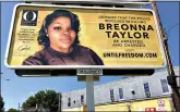  ?? (AP Photo/Dylan T. Lovan) ?? A billboard sponsored by O, The Oprah Magazine, is on display with with a photo of Breonna Taylor on Friday in Louisville, KY. Twenty-six billboards are going up across Louisville, demanding that the police officers involved in Taylor’s death be arrested and charged. Taylor was shot multiple times March 13 when police officers burst into her Louisville apartment using a no-knock warrant during a narcotics investigat­ion. No drugs were found.