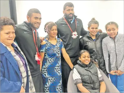  ?? Picture: INGRID LEARY ?? Flying Fijians halfback Simione Kuruvoli (second from left) and teammate Tevita Ratuva pose with Fijian fans at their welcoming ceremony in Christchur­ch, New Zealand.
