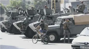  ?? ?? Lebanese army soldiers stand guard in Tayouneh