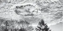  ?? CONTRIBUTE­D ?? Matt Mckinnon captured this fallstreak hole, also known as a holepunch cloud.