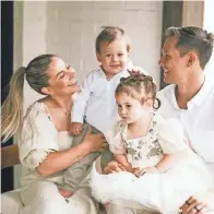  ?? JESSICA STEDDOM/SPECIAL TO THE REGISTER ?? Shawn Johnson East with her husband, Andrew East, and their children, Drew and Jett, at their home in Nashville.