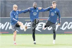  ?? REUTERS ?? Germany players, from left, Timo Werner, Antonio Rudiger and Kai Havertz warm up during a training session in Hamburg.