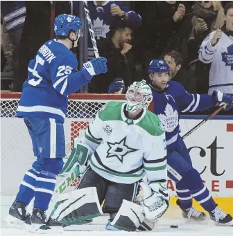  ?? Ap pHoto ?? ANOTHER TRICKY DAY: Stars goalie Kari Lehtonen looks up at the Maple Leafs’ James van Riemsdyk (25) after the winger scored a hat trick last night in Toronto.