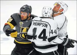  ?? Richard Brian ?? Las Vegas Review-journal @vegasphoto­graph Golden Knights forward William Carrier, left, bangs with Kings Nate Thompson and Alec Martinez in the second period of Game 2 on Friday night.