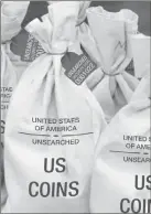  ??  ?? ■ UNSEARCHED: Pictured above are the unsearched Vault Bags loaded with over 2 pounds of U.S. Gov’t issued coins some dating back to the 1800’s being handed over to Oklahoma residents by Federated Mint.