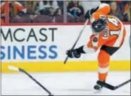  ?? THE ASSOCIATED PRESS FILE ?? The Flyers’ Sean Couturier got turned and twisted the wrong way in a collision with rock-hard defenseman Radko Gudas Tuesday during a practice at the Skate Zone. Couturier’s status is unknown with Game 4 of a first-round series with the Penguins looming.