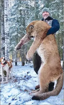  ?? Canadian Press photo ?? Canadian TV host Steve Ecklund holds a cougar in a photo from his Facebook page. The Canadian TV personalit­y is taking heat online after he killed a cougar in northern Alberta. Ecklund, who’s the host of outdoor show “The Edge,” bragged about hunting a...