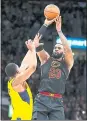  ?? GREGORY SHAMUS — GETTY IMAGES ?? LeBron James fires the winning shot over the Pacers’ Thaddeus Young. James scored 44 points.