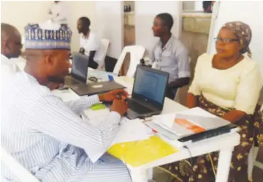  ??  ?? Next of kin of deceased pensioners undergoing verificati­on at PTAD’s office in Abuja