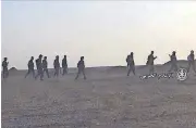  ?? [AP PHOTO] ?? This frame grab from video provided by the government­controlled Syrian Central Military Media and released Sunday shows Syrian forces taking up positions during fighting between Government forces and Islamic State group militants, in the Palmyra...