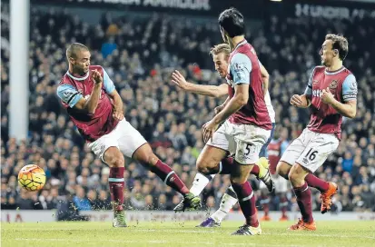  ?? Photo: REUTERS ?? West Ham’s Winston Reid, left, fails to stop Tottenham Hotspur’s Harry Kane from scoring one of his two goals in Spurs’ 4-1 win at White Hart Lane yesterday.