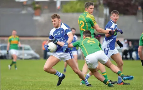  ??  ?? Barry John Keane evades the tackle of South Kerry’s Graham O’Sullivan, as the Kerry panellist scored five points from play (0-7 in total) in Kerins O’Rahillys County SFC Round 1 win in Strand Road, Tralee on Sunday afternoon