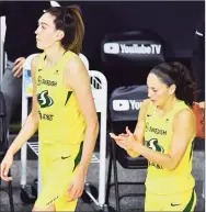  ?? Julio Aguilar / Getty Images ?? The Storm’s Breanna Stewart, left, and Sue Bird walk on to the court following a 104-91 win over Las Vegas Aces on Sunday in Game 2 of the WNBA Finals.