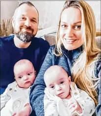  ?? COURTESY OF REBECCA ROBERTS ?? Rhys Weaver (left) and Rebecca Roberts of Wiltshire, England, pose with their twins in March. They were born two minutes apart on Sept. 17 after Roberts had a Caesarian section.