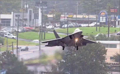  ??  ?? / Kelly J. Huff-MDJ One of the F-22 Raptor Demo Team’s F-22s crosses over South Cobb Parkway on Thursday into Dobbins Air Reserve Base in Marietta, where they will stage for Rome’s Wings Over North Georgia air show this weekend.