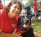  ?? CONTRIBUTE­D ?? Toni Appling poses with her dog Libby during a Dunwoody Fourth of July celebratio­n where she set up a booth for the Atlanta Dog Squad in 2008. Appling was born with an inherited kidney disorder.