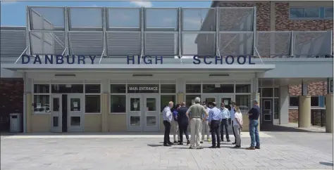  ?? H John Voorhees III / Hearst Connecticu­t Media file photo ?? Gov. Ned Lamont talks to local officials before a news conference at Danbury High School.