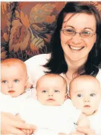  ??  ?? ●● Louise McGuinness, from Rossendale, who had been on Herceptin for 11 years after being diagnosed with terminal liver cancer is pictured with her triplets Hannah, Charlotte and Cameron in 2005. They are all now teenagers