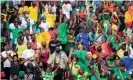  ?? Photograph: Thaier Al-Sudani/Reuters ?? Fans in the Olembe Stadium. A strong match-going culture in Cameroon is expected to contribute to healthy crowds throughout the tournament.