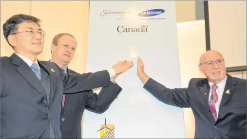  ?? COLIN MACLEAN/JOURNAL PIONEER ?? Summerside has officially flipped the switch on solar power in the city. Performing the honours Friday are, from left, Eskay Lee, president of Samsung Renewable Energy Canada Inc., Egmont MP Bobby Morrissey and Summerside Mayor Bill Martin.