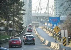  ?? ARLEN REDEKOP ?? The Dunsmuir Viaduct, above, and the Georgia Viaduct will be torn down at a cost of $240 million as part of the redevelopm­ent of northeast False Creek.