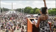  ?? JONATHAN ERNST / POOLVIAAP ?? Yolanda Renee King, granddaugh­ter of the Rev. Martin Luther King Jr., raises her fist as she speaks during the March onWashingt­on last Friday.