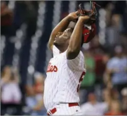  ?? MATT SLOCUM — THE ASSOCIATED PRESS ?? Phillies closer Hector Neris gives thanks above after locking down another save Tuesday night against the Nationals.