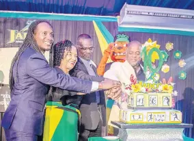  ??  ?? Alexander Williams (right), chairman and June Spence-Jarrett (second left), executive director, both of JADCO, cut the JADCO 10th anniversar­y cake at JADCO’s Decennial Gala with Alando Terrelonge (left), Minister of State in the Ministry of Culture, Gender, Entertainm­ent and Sport and Denzil Thorpe, Permanent Secretary in the Ministry of Culture, Gender, Entertainm­ent and Sport. In the background is Leo, the Dope Patrol Officer, JADCO’s mascot.