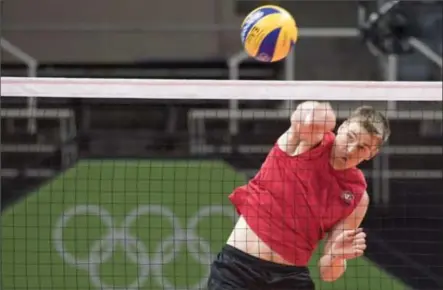  ?? FRANK GUNN, THE CANADIAN PRESS ?? Canadian volleyball player Gord Perrin spikes a ball during team practice in Rio on Wednesday.