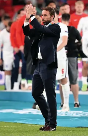  ?? Picture: Paul Ellis/Getty ?? Gareth Southgate applauds the fans after England’s defeat by Italy in the Euro 2020 final at Wembley on Sunday night