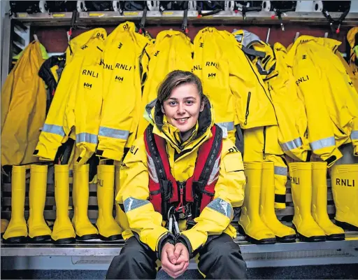  ??  ?? RNLI recruit Luciana Mcgarvie, 17, awaits her first call-out at Girvan lifeboat station as part of dad Gary’s lifesaving team