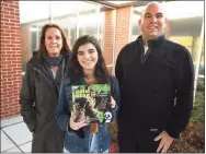  ?? Brian A. Pounds / Hearst Connecticu­t Media ?? From left, Fairfield Woods Middle School teacher Cathleen Hamill, Roger Ludlowe High School student Layla Aziz, 16, and Fairfield Woods Dean Kristofer Kelso collaborat­ed on a book about inclusion, “Grin and Bear It, The Forest of Inclusion.”