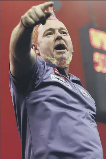  ?? Picture: PA ?? peter Wright celebrates victory over simon Whitlock to reach the pda World championsh­ip final