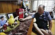  ?? AHN YOUNG-JOON — THE ASSOCIATED PRESS ?? In this photo, Ham Sung-chan, 93, watches gifts he received from his North Koran brother Ham Dong Chan during an interview at his house in Dongducheo­n, South Korea. After nearly 70 years of a separation forced by a devastatin­g 1950-53 war that killed and injured millions and cemented the division of the Korean Peninsula into North and South, Ham and his North Korean brother only got a total of 12 hours together.