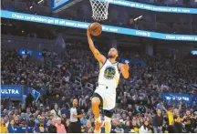  ?? AP-Yonhap ?? Golden State Warriors guard Stephen Curry drives to the basket against the Memphis Grizzlies during the first half of Game 4 of an NBA basketball Western Conference playoff semifinal in San Francisco, Monday.