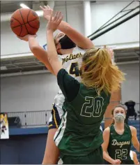  ?? MATTHEW B. MOWERY — FOR MEDIANEWS GROUP ?? Clarkston’s Kaelyn Kaul goes up for a lay-up over the defense of Lake Orion’s Madeleine Ebbert (20) in the second half of the Wolves’ 56-32 Senior Night win over the Dragons, on Monday.