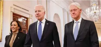  ?? Chip Somodevill­a/Getty Images ?? Vice President Kamala Harris, President Joe Biden and former President Bill Clinton mark the 30th anniversar­y of the Family and Medical Leave Act on Thursday.