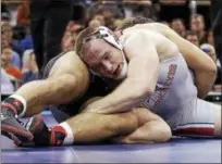  ?? JULIE JACOBSON — THE ASSOCIATED PRESS ?? Kyle Snyder, right, wrestles North Carolina State’s Nick Gwiazdowsk­i in the 2016 NCAA heavyweigh­t championsh­ip match in New York. Snyder won in overtime.