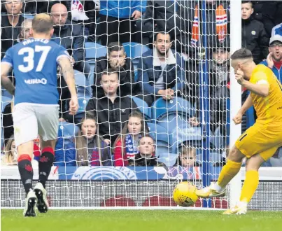  ??  ?? Lead man Steven Lawless kept his composure to convert the spot-kick and to put Livi in front at Ibrox