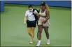  ?? SETH WENIG — THE ASSOCIATED PRESS FILE ?? Serena Williams walks to her bench with a trainer for a medical timeout during a semifinal match at the U.S. Open against Victoria Azarenka in New York on Sept. 10.