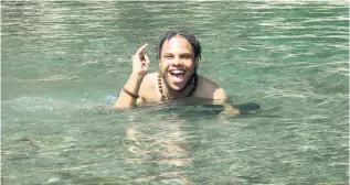  ??  ?? Toussaint Stone of Merritt College Oakland, California, chilling in Portland’s Spanish River.