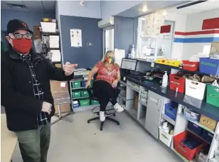  ?? CLIFFORD SKARSTEDT EXAMINER ?? Charles Shamess, executive director of PARN, gives a tour of the harm reduction clinic with volunteer Chanti Cameron at the former Greyhound Bus Terminal on Wednesday.