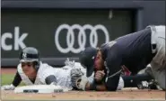  ?? JULIE JACOBSON — THE ASSOCIATED PRESS ?? New York Yankees’ Ronald Torreyes, left, advances to third base safely ahead of the throw to Cleveland Indians third baseman Jose Ramirez after tagging up on a fly ball by Brett Gardner during the fifth inning of a baseball game, Saturday in New York.