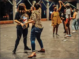  ?? (Special to the Democrat-Gazette/Samantha Gentry) ?? The Little Rock Queer Girls group hosted a Salsa Night on Oct. 11 at the River Market in Little Rock. Partners socially distanced from others and were able to learn a few moves from instructor Victoria Fender.