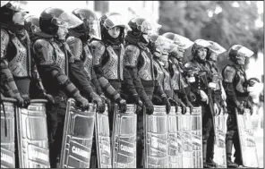  ?? AP/ANDREW MEDICHINI ?? Police line up as protesters showing their support for the European Union march Saturday in Rome, where EU leaders gathered to mark the bloc’s 60th anniversar­y.