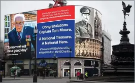  ??  ?? WELL DONE, SIR: A message to Captain Tom in the UK capital yesterday