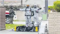  ?? ?? Officers from the hazardous materials team wash in their personal protection equipment during the counter-terrorism exercise.